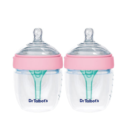 Two Dr. Talbot's Squeezy Silicone Anti-Colic Bottles (2 Pack, 5 oz), clear with pink lids, easy latch silicone nipples, and green venting systems. “Dr. Talbot's” is printed in blue near the base of each bottle.