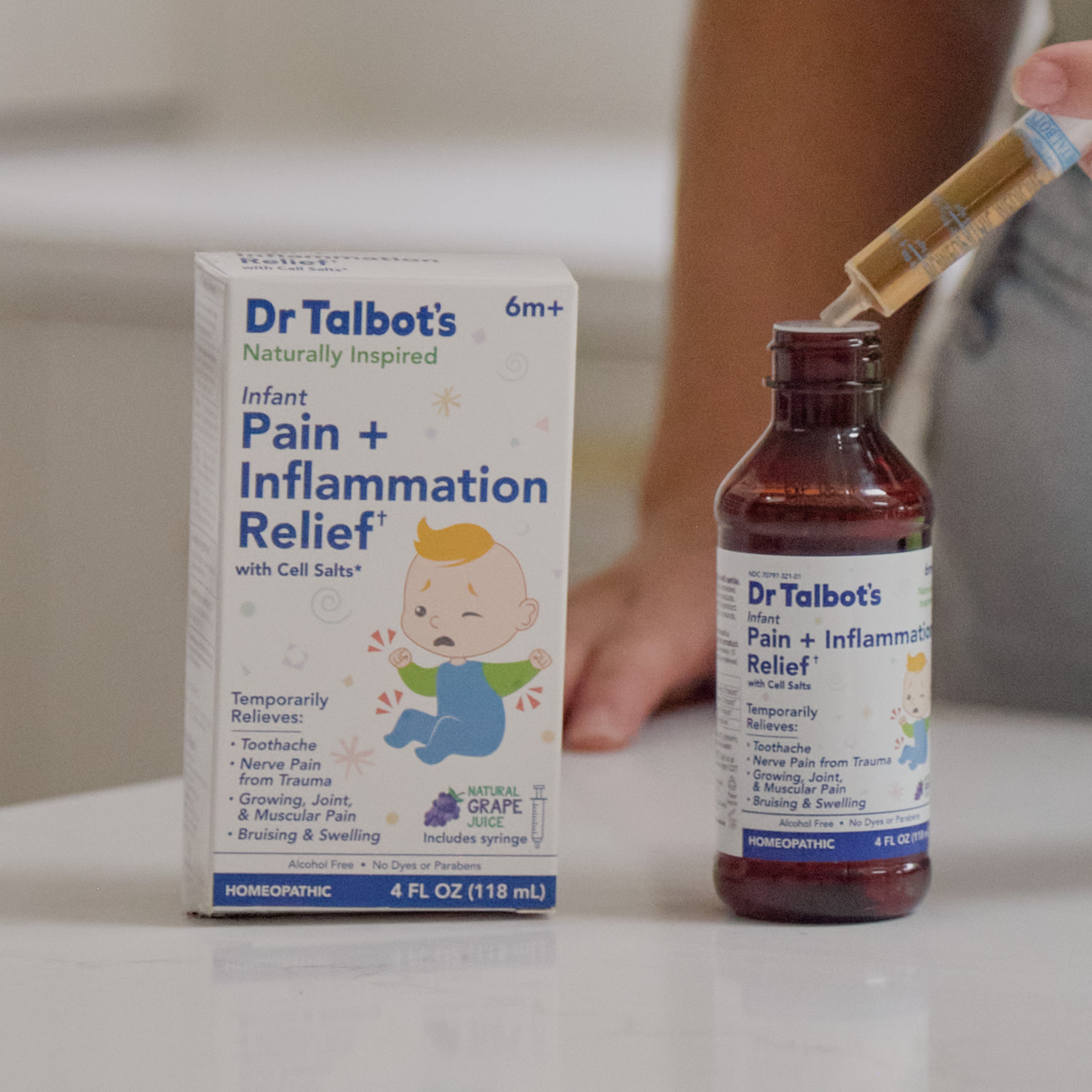 Dr. Talbot’s Infant Pain + Inflammation Relief medicine box and bottle with a syringe held above the open bottle.