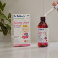A bottle of Dr. Talbot’s Infant Tummy Ache Relief and a dropper being filled, positioned next to the product box.
