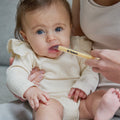 An adult uses a clear plastic Dr. Talbot’s Sure-Dose™ Medicine Syringe to gently administer an accurate dosage of medicine to a baby.