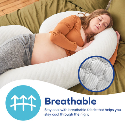 A pregnant woman sleeps comfortably on her side, hugging Dr. Talbot's Mom Stay Cool Pregnancy Pillow | C Shape with white breathable fabric. An inset highlights the pillow’s mesh texture. Text: Breathable—stay cool and comfortable all night.