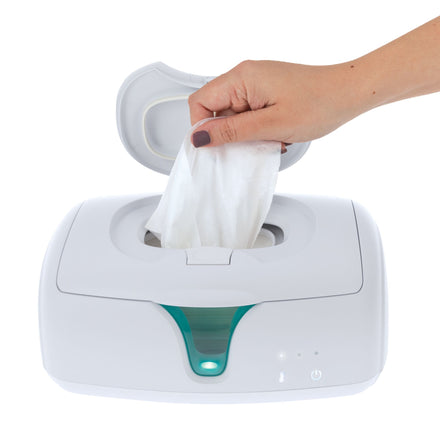 A hand pulls a wet wipe from Dr. Talbot's Easy-Open Wipe Warmer with a partially open lid and indicator lights, making diaper changes easier.