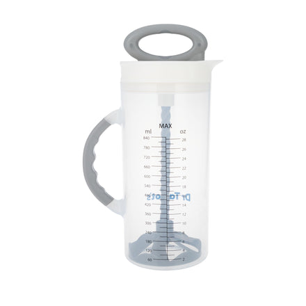 Dr. Talbot's Hand-Mixing Formula & Breast Milk Pitcher is a clear plastic pitcher with a gray handle and lid, measurement markings in ml and oz, and a plunger mechanism for easy formula mixing.