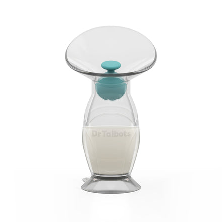 Dr. Talbot’s Silicone Breast Pump, featuring a wide opening and teal stopper, stands upright partially filled with milk on a white background—a hands-free breast pump and essential for new moms.