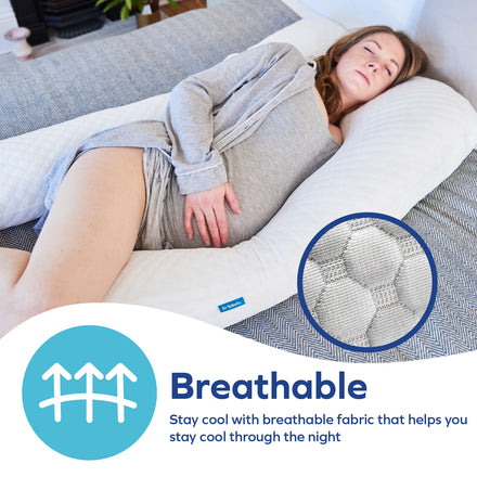 A woman hugs Dr. Talbot's Mom Stay Cool Pregnancy Pillow | U Shape on a bed. An inset shows the breathable fabric. Text reads: Breathable—stay cool and comfortable all night with our pillow’s airy fabric design.